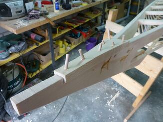 Dowels connect the top board with both gunwales and the bow stem