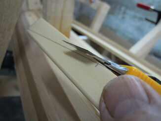 Fitting the end of a strip - making a raw cut with a utility knife